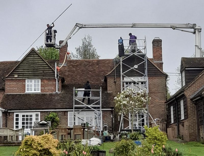 The Roof Moss Cleaners using cherry picker and scaffolding to clean roof safely and professionally in Wotton-under-Edge, Gloucestershire